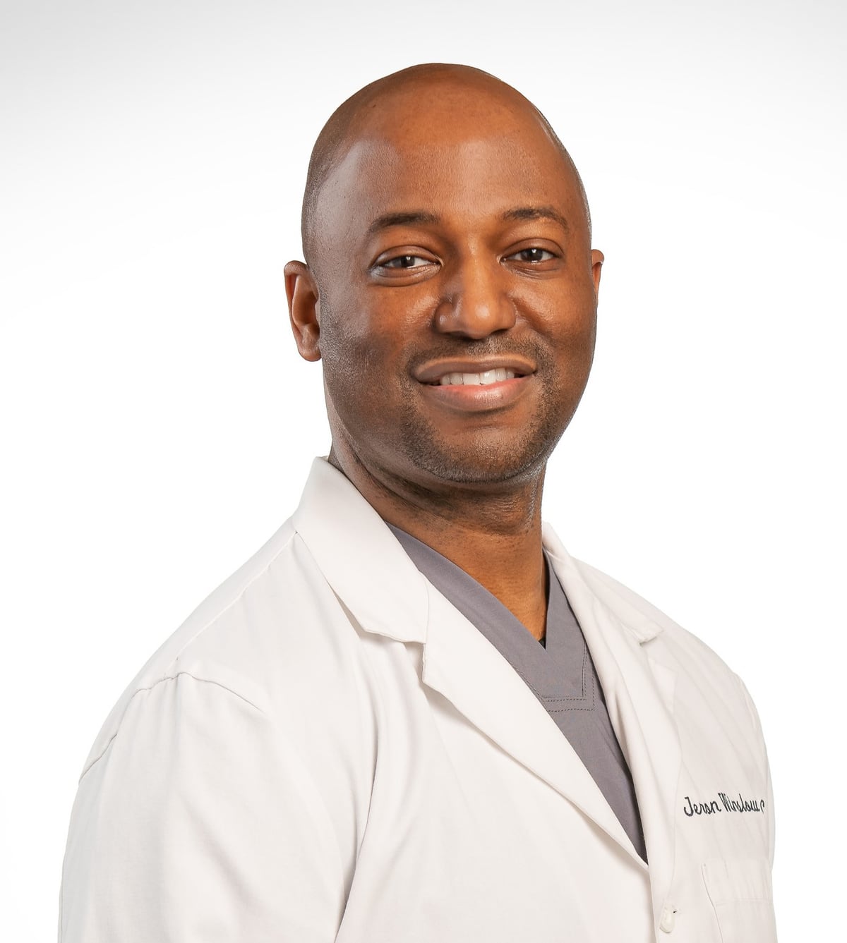 Dr. Winslow, founder of Arlo AI, in a white clinical coat